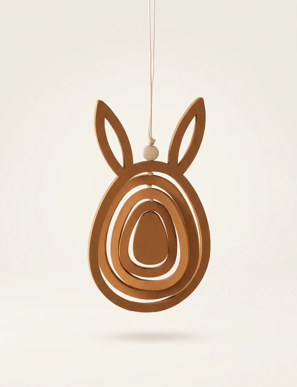 Hängender Holz-Osteranhänger Bouncer in Hasenform mit konzentrischen Ei-Ringen und Holzperle